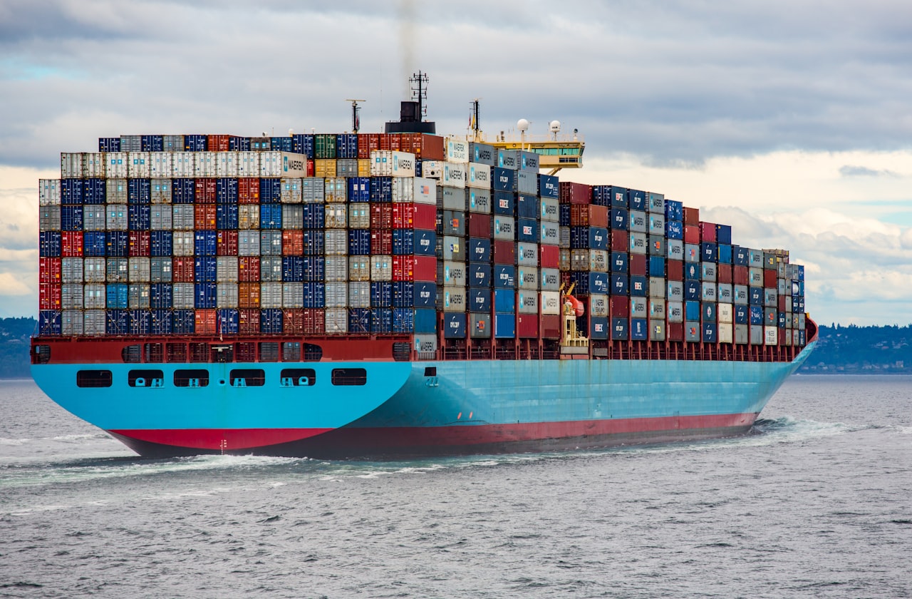 Shipping containers at a port representing trade and procurement